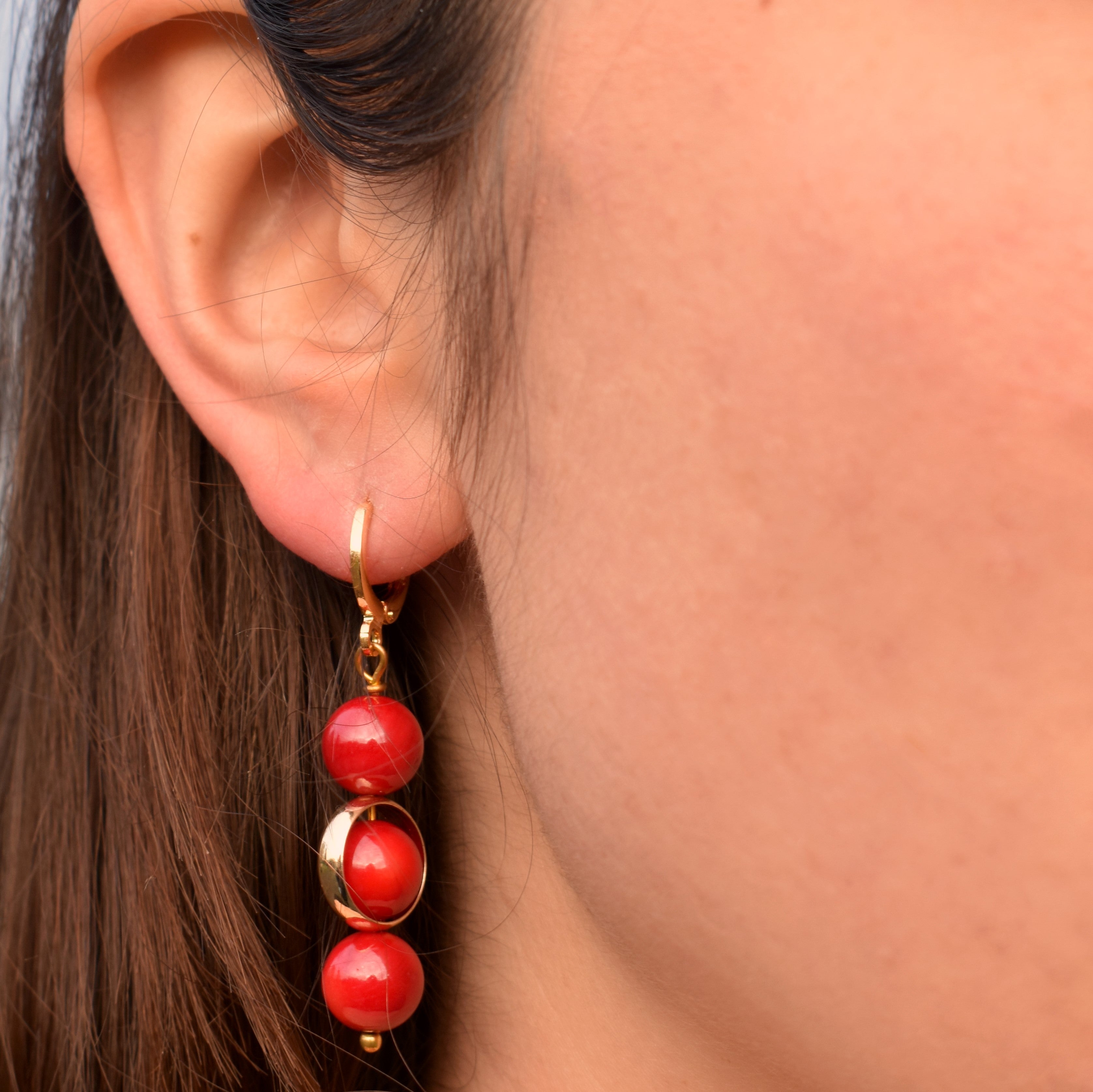 Coral gemstone asymmetric gold huggie earrings | by Ifemi Jewels